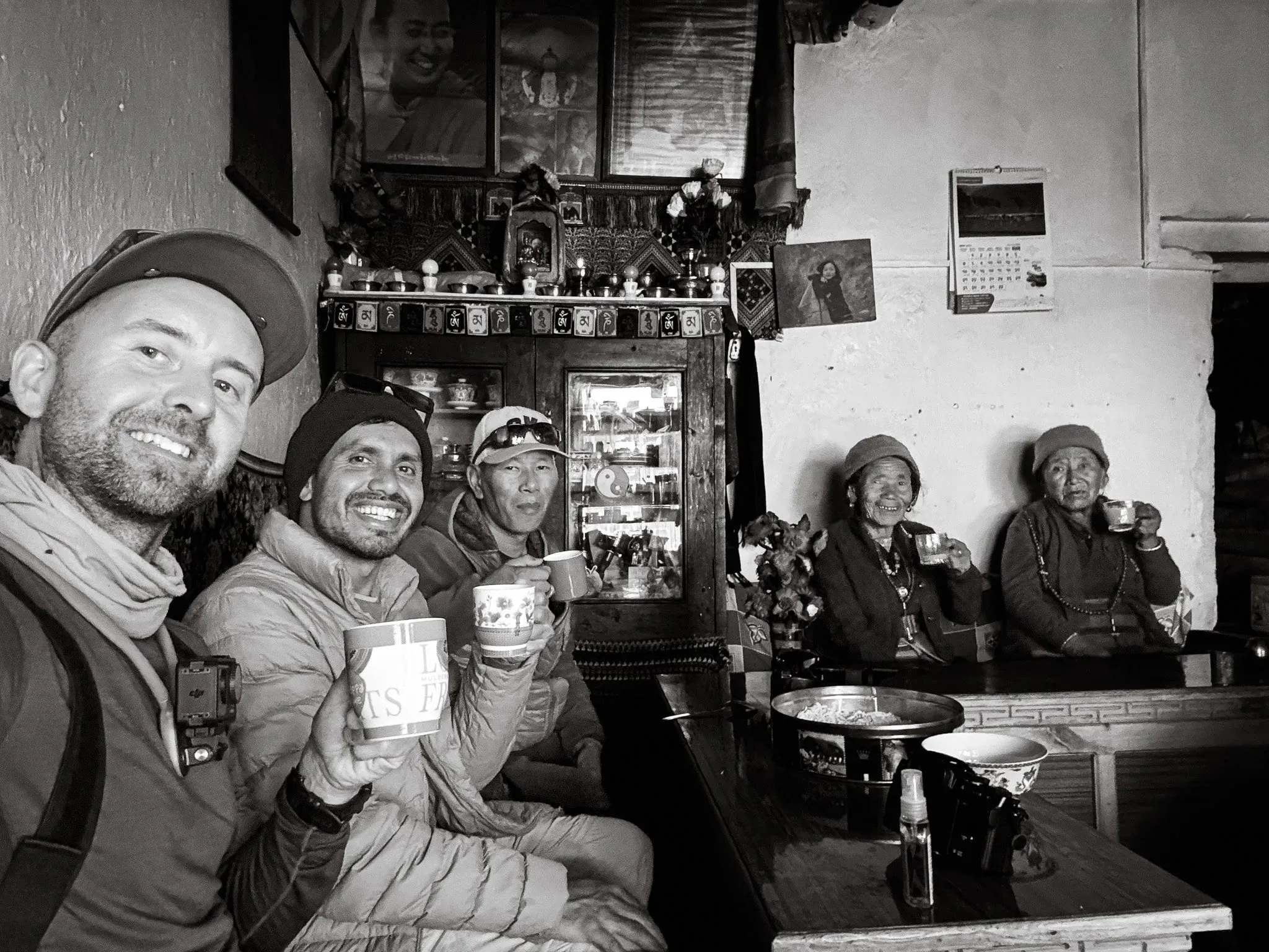 Black and white photo of people in a cafe in Lo Manthang, Upper Mustang, Nepal