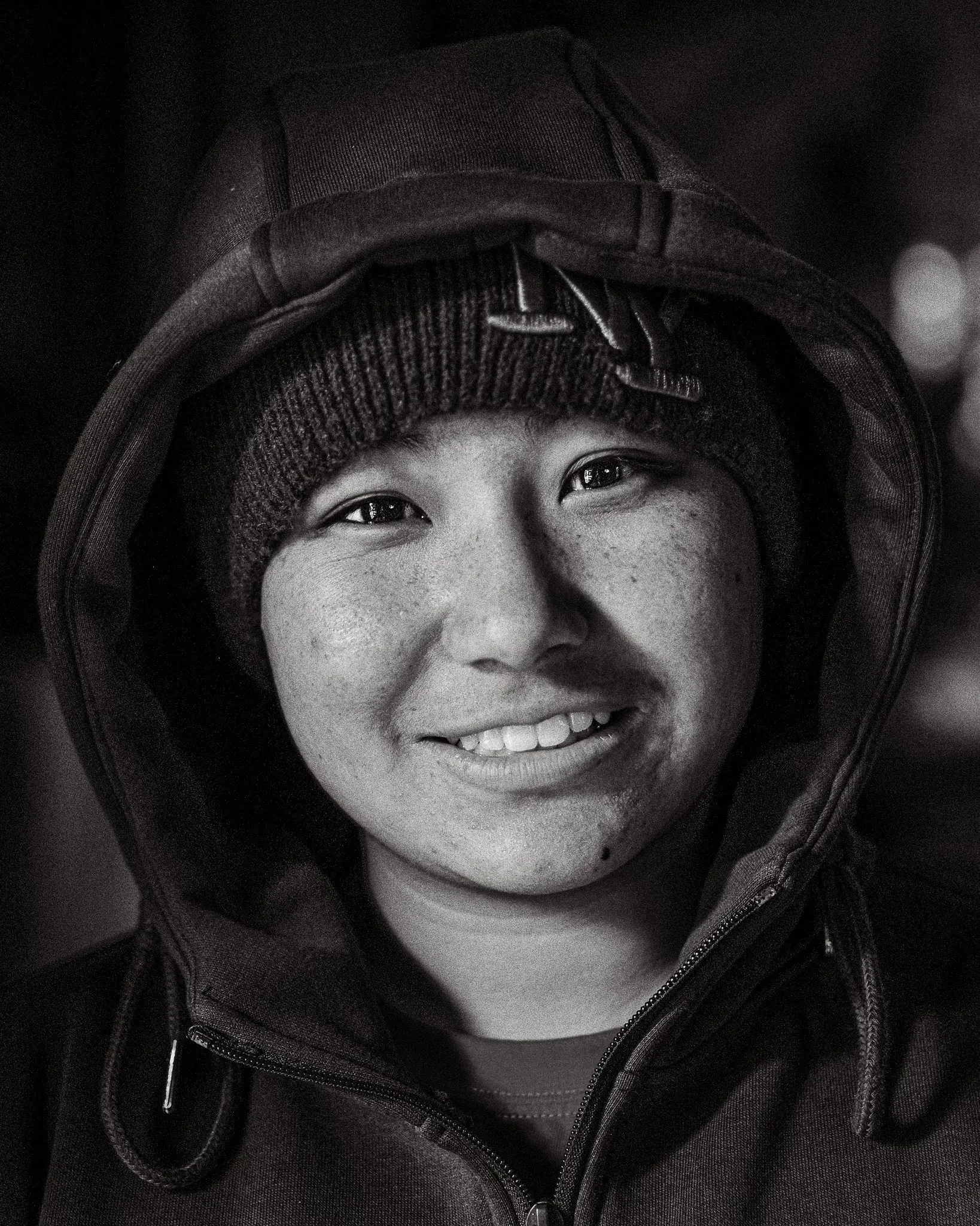 Black and white portrait of a young nun in Muktinath, Mustang, Nepal