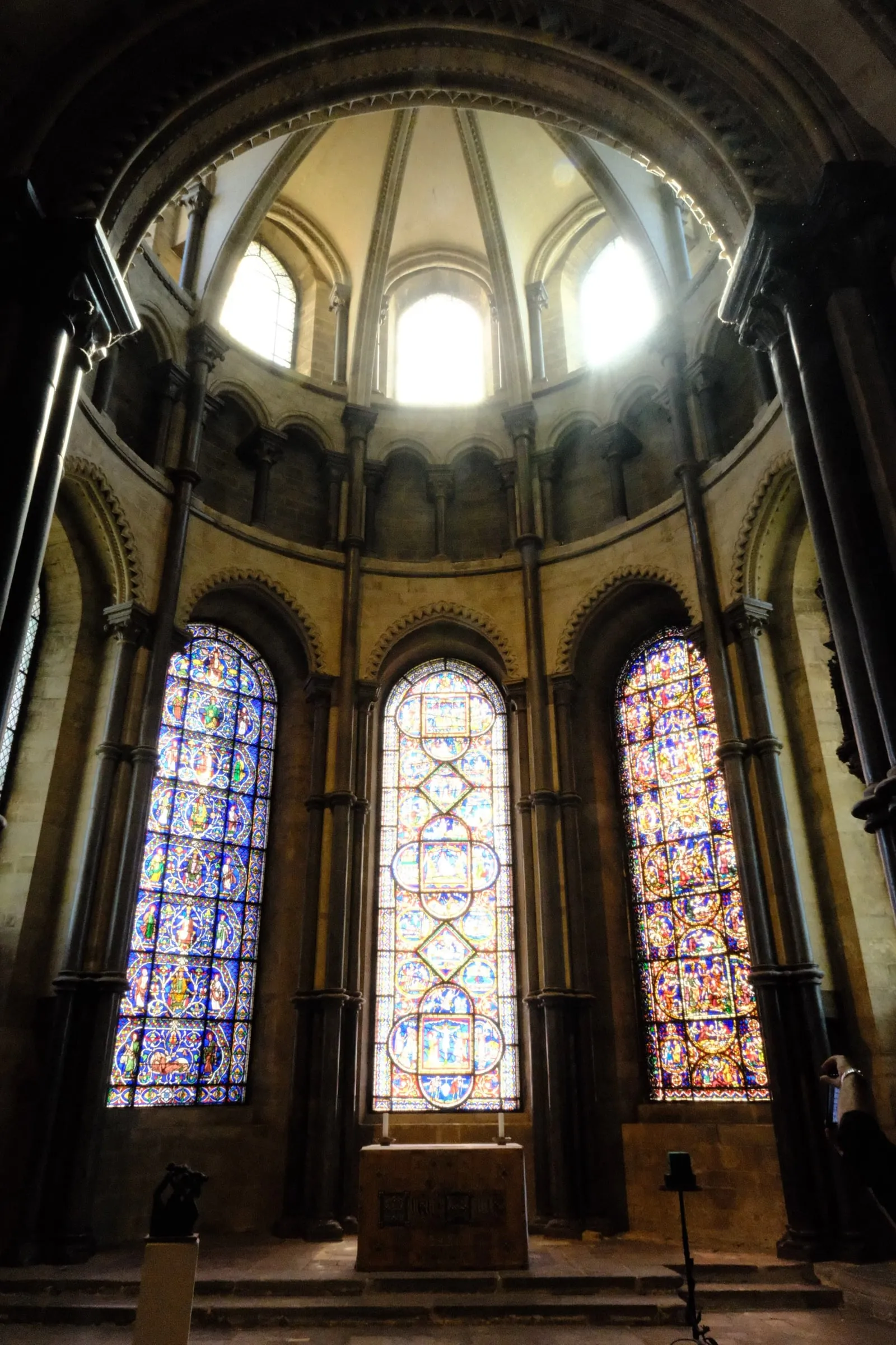 Three stained glass windows beneath a domed apse lit from above, Canterbury Cathedral