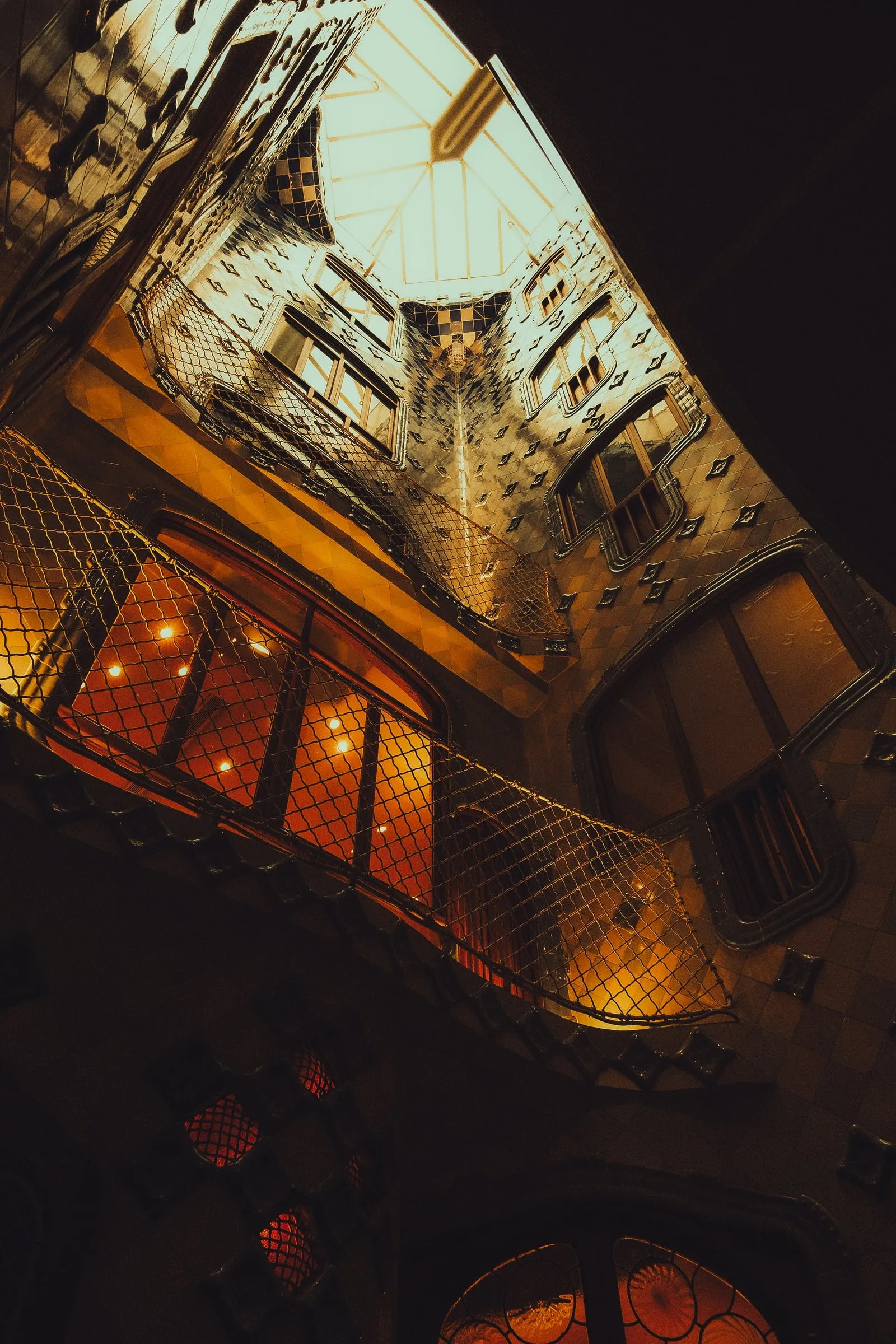 Inside Casa Batlló, the skylight illuminates the winding staircase and highlights Gaudí’s ocean-inspired design, which makes for a unique photo opportunity.