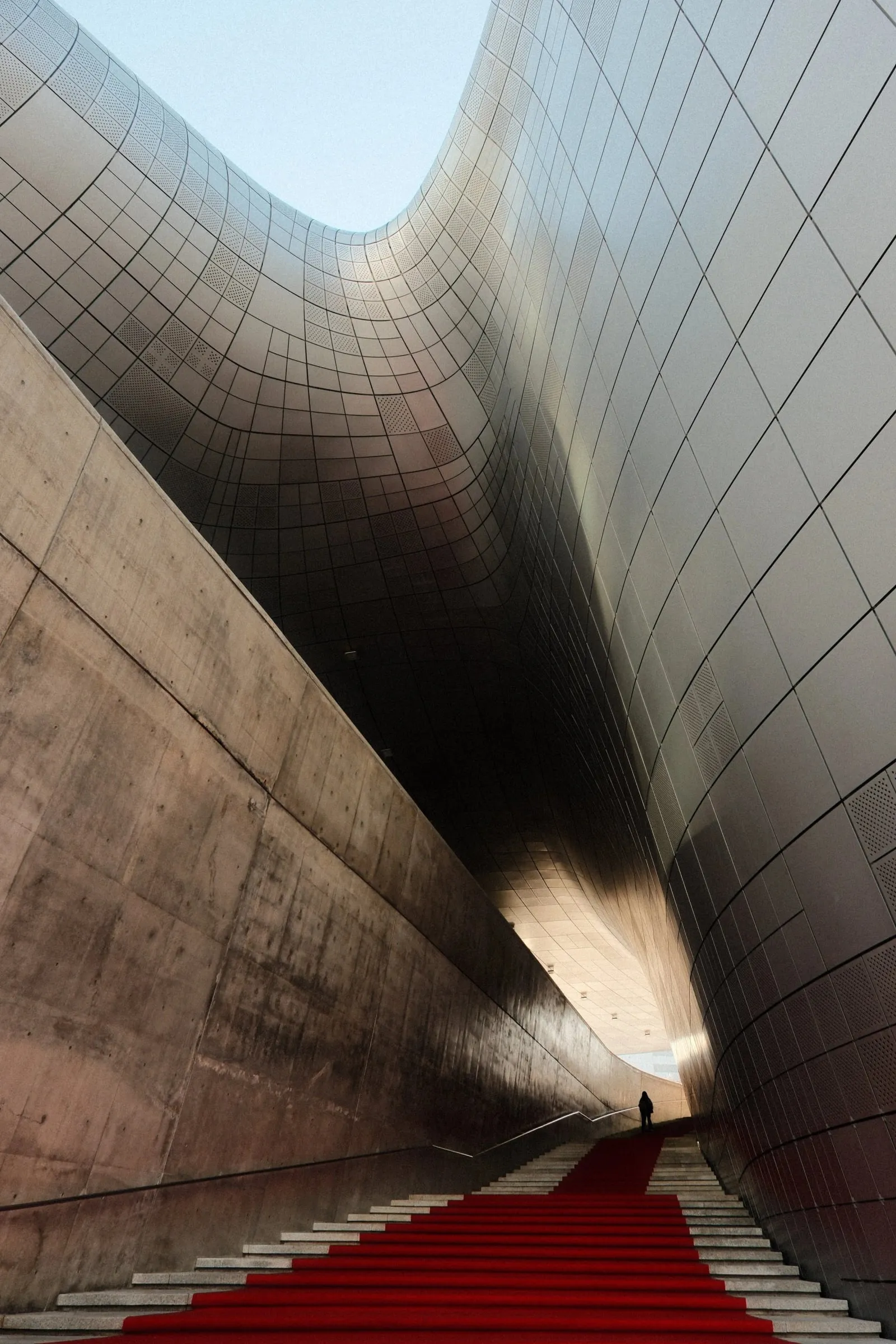 a person walking through Dongdaemun Design Plaza