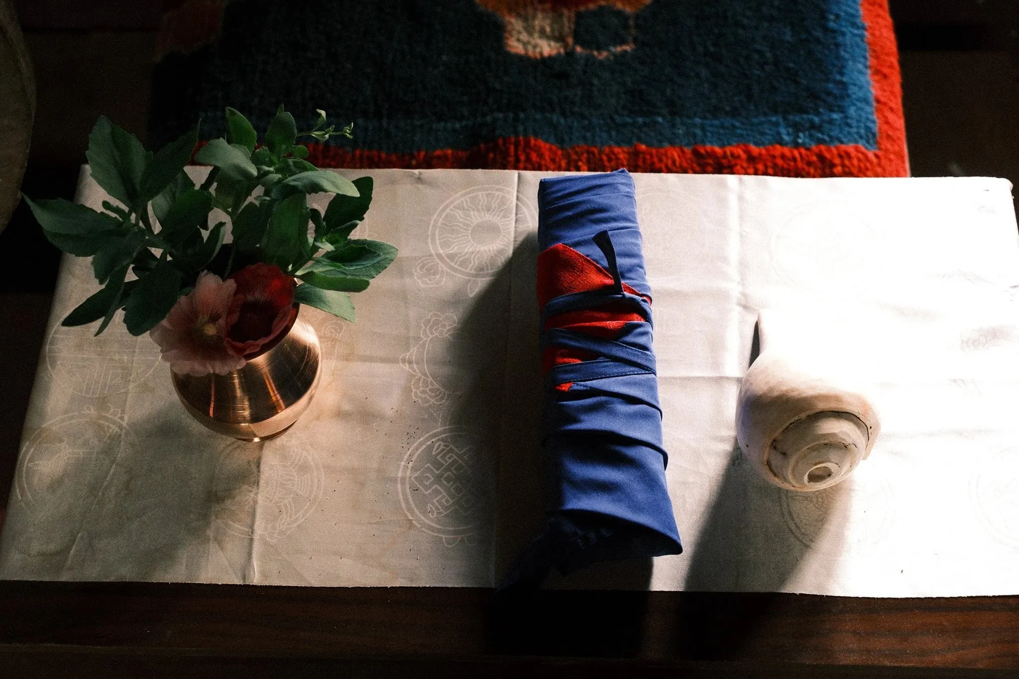 Photo of a Buddhist scroll and a conch shell at a monastery in Upper Mustang