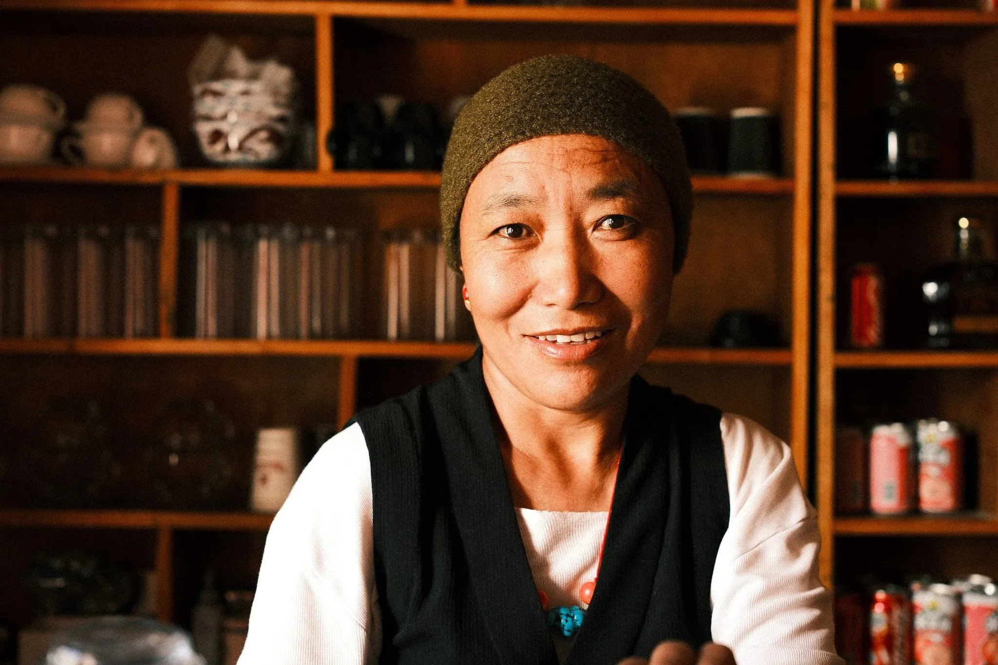 Photo of a woman working in a cafe in Lo Manthang, Upper Mustang, Nepal